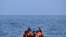FILE—Migrants travel in an inflatable boat across the English Channel, bound for Dover on the south coast of England.