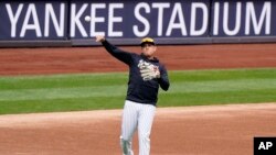 The baseball season starts on April 1. The first game is known as Opening Day. In this photo, a member of the New York Yankees practices on March 31, 2021. (AP Photo/Kathy Willens)