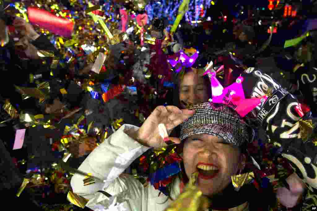 People celebrate the arrival of the year 2020 at a New Year&#39;s Eve countdown event near the 2022 Beijing Winter Olympic headquarters in Bejing, China.