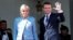 French President Emmanuel Macron and his wife, Brigitte Trogneux, wave to former President Francois Hollande as he leaves after the handover ceremony at the Elysee Palace in Paris, May 14, 2017.