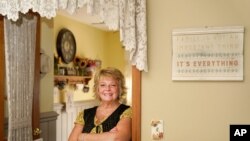 Kay Orzechowicz poses Wednesday, Sept. 2, 2020, for a portrait at her Griffith, Ind., home. After 35 years of teaching, Orzechowicz said COVID-19 "pushed her over the edge" to retire from northwest Indiana's Griffith High School at the end of July. 