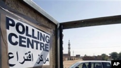 Unidentified observers of the European Union Election Observation Mission for the Southern Sudan Referendum arrive at a polling center in the city of Um Durman, Sudan. Southern Sudan's military spokesman says 20 policemen in the disputed north-south regio