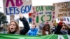 Climate activists demonstrate in front of the International Court of Justice in The Hague, Netherlands, on Dec. 2, 2024.