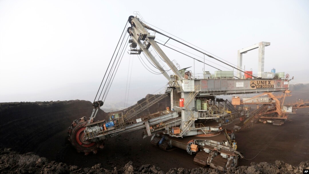 A huge excavator digs in a giant open-pit lignite mine near the Czech Republic town of Most, Nov. 6, 2015. The fossil fuel is a major source of greenhouse gases.