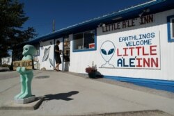 A person walks into the Little A'Le'Inn, Wednesday, Sept. 18, 2019, in Rachel, Nev. No one knows what to expect, but lots of people are preparing for "Storm Area 51" in the Nevada desert.