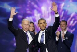 FILE - Vice President Joe Biden and President Barack Obama wave to the delegates at the conclusion of President Obama's speech at the Democratic National Convention, September 6, 2012.