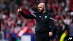 FILE — Morocco's coach Walid Regragui gives a thumbs up during the International friendly soccer match against Peru at the Civitas Metropolitano stadium in Madrid, Spain, March 28, 2023.