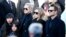 FILE - French rock star Johnny Hallyday's wife Laeticia, second left, his daughters Jade, left, and Joy, Laura Smet, second right, and son David Hallyday, right, arrive at La Madeleine church for Johnnny Hallyday's funeral ceremony in Paris, Dec. 9, 2017. 