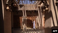 FILE —An Omani man opens his shop at Bahla Fort, one of four historical forts located at the foot of the Green Mountain highlands of Oman, and the only fort in the country designated a UNESCO Heritage Site, in Bahla, 200km north of Muscat, on October 5, 2023.