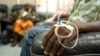 FILE - Cancer patients sit in a chemotherapy ward while receiving treatment at the Korle Bu Teaching Hospital in Accra, April 24, 2012. Most of Africa's around 2,000 languages have no word for cancer.