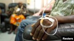 FILE - Cancer patients sit in a chemotherapy ward while receiving treatment at the Korle Bu Teaching Hospital in Accra, April 24, 2012. Most of Africa's around 2,000 languages have no word for cancer.