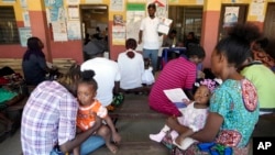 Women wait to have a malaria vaccine administered to their children at the comprehensive Health Centre in Agudama-Epie, in Yenagoa, Nigeria, Dec. 9, 2024.