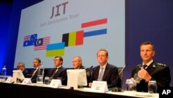 Officials from the Joint Investigation Team probing the downing of Malaysia Airlines Flight 17 in 2014 appear at a press conference in Nieuwegein, Netherlands, on June 19, 2019. 