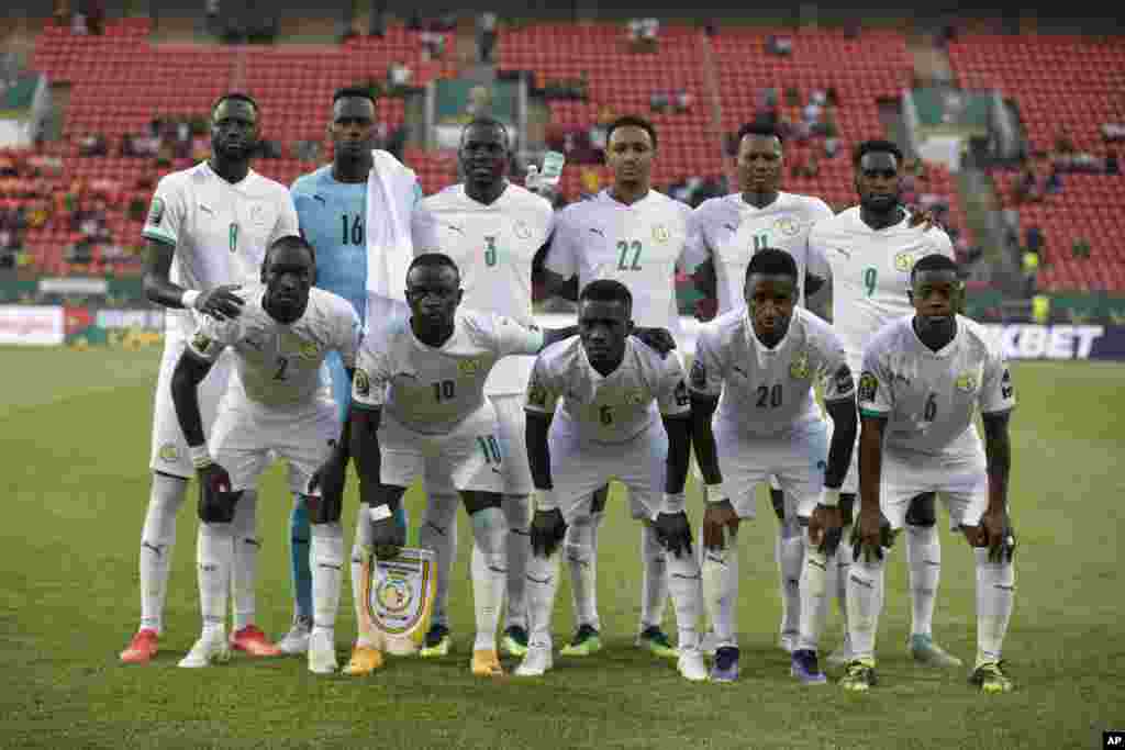 Senegal team players pose before the soccer match between Malawi and Senegal; Cameroon, Jan. 18, 2022.