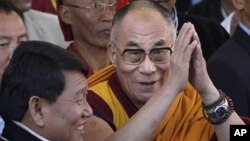 Arunchal Pradesh state Chief Minister Dorjee Khandu is seen to the left of Dalai Lama, in the northeastern Arunachal Pradesh state, India, Sunday, Nov. 8, 2009.