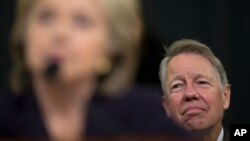 FILE - David Kendall, attorney for then-Democratic presidential candidate Hillary Clinton, listens as she testifies on Capitol Hill, Oct. 22, 2015. Kendall says the FBI acted inappropriately when it announced the revival of its investigation into her private email setup days before the November 8 presidential election. 