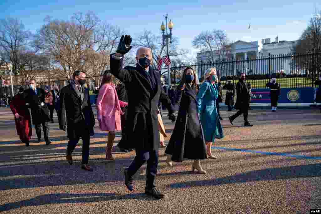 President Joe Biden, First Lady Jill Biden and family, walk in front of the White House during a Presidential Escort to the White House in Washington. (Credit: Doug Mills/The New York Times)