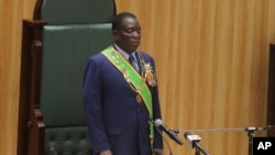 FILE — Zimbabwean President Emmerson Mnangagwa prepares to deliver his speech in parliament during his State of the Nation address in Harare, on October 3, 2023