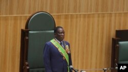 Zimbabwean President Emmerson Mnangagwa prepares to deliver his speech in parliament during his State of the Nation address in Harare,Zimbabwe, October 3, 2023. 