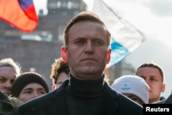 FILE - Russian opposition politician Alexei Navalny takes part in a rally in Moscow, Feb. 29, 2020.