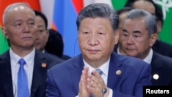 Members of the Chinese delegation, led by President Xi Jinping, be  a plenary league   astatine  the BRICS acme  successful  Kazan, Russia, Oct. 24, 2024.