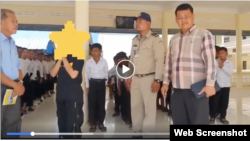 A photo from a video posted by Kampot police officials on Wednesday making an underage student publicly apologize for allegedly spreading fake news in a private Facebook audio message. (Photo from Facebook page of Kampot police officials) 