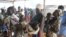FILE - Women who fled fighting in South Sudan arrive at Bidi Bidi refugee’s resettlement camp in northern Uganda, Dec. 7, 2016.