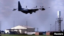 FILE - A U.S. Hurricane transport plane takes off from RAF Mildenhall, Suffolk, England. 