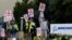FILE - Boeing factory workers gather on a picket line during the first day of a strike near the entrance of a production facility in Renton, Washington, Sept. 13, 2024.