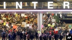 Hundreds of people opposed to President Donald Trump's executive orders barring entry to the U.S. of seven predominantly Muslim countries demonstrate at the Tom Bradley International Terminal at Los Angeles International Airport, Jan. 28, 2017. 