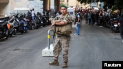 A soldier looks on near American University of Beirut Medical Center as more than 1,000 people were wounded when the pagers they use to communicate exploded across Lebanon, according to a security source, in Beirut, Sept. 17, 2024.