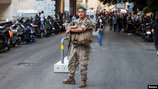 A soldier looks on near American University of Beirut Medical Center as more than 1,000 people were wounded when the pagers they use to communicate exploded across Lebanon, according to a security source, in Beirut, Sept. 17, 2024.