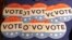 Computer mouse pads with Secure the Vote logo are seen on a vendor's table at a convention of state secretaries of state, July 14, 2018, in Philadelphia.