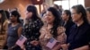 FILE - Women take part in a naturalization ceremony, March 8, 2024, in San Antonio. More than half the U.S. foreign-born population lives in just four states — California, Texas, Florida and New York — a Census Bureau report released in April 2024 said.