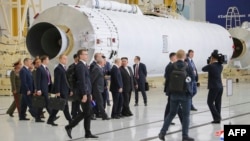 This picture taken on Sept. 13, 2023 and released by North Korea's official Korean Central News Agency (KCNA) on Sept. 14 shows North Korea's leader Kim Jong Un (center R) and Russia's President Vladimir Putin (center L) visiting the Vostochny Cosmodrome in Russia's Amur region.