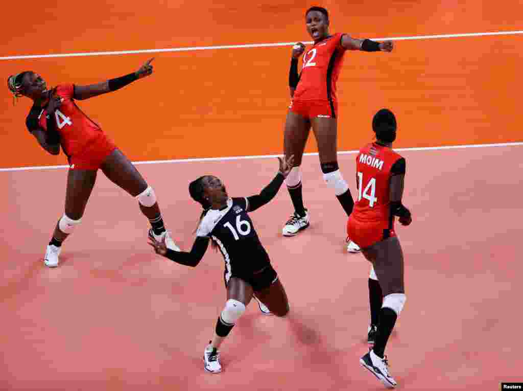 Leonida Kasaya of Kenya, Gladys Ekaru of Kenya and Agripina Kundu of Kenya celebrate during the Tokyo Olympics Volleyball - Women&#39;s Pool A&nbsp; South Korea v Kenya. REUTERS/Valentyn Ogirenko