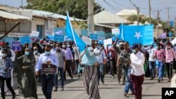 FILE - Somalis protest against the government and the delay of the country's election in the capital, Mogadishu, Feb. 19, 2021.
