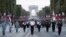 Japanese troops parade on the Champs Elysees avenue during a rehearsal for Bastille Day, early Wednesday, July 11, 2018, in Paris. Japanese and Singapore soldiers will take part in the annual Bastille Day next Saturday. 