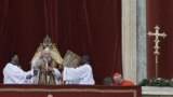 Pope Benedict delivers his "Urbi et Orbi" (to the City and to the World) speech from the central loggia of St. Peter's Basilica, at the Vatican, December 25, 2012. 