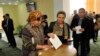 FILE - An Uzbek woman casts her ballot at a polling station in Tashkent, Uzbekistan, March 29, 2015. No Uzbek election has ever been rated as “democratic.”