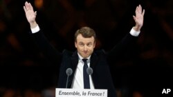 French President-elect Emmanuel Macron gestures during a victory celebration outside the Louvre museum in Paris, May 7, 2017. 