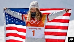 Chloe Kim, of the United States, celebrates winning gold in the women's halfpipe finals at Phoenix Snow Park at the 2018 Winter Olympics in Pyeongchang, South Korea, Feb. 13, 2018.