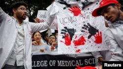 FILE - Doctors shout slogans during a protest demanding justice following the rape and murder of a trainee doctor at a Kolkata hospital, in New Delhi, India, on Aug. 19, 2024.