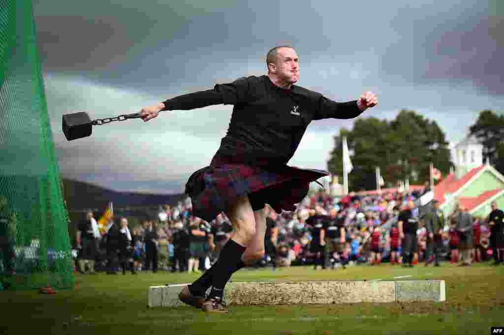 A competitor takes part in the Hammer Throw event at the annual Braemar Gathering in Braemar, central Scotland, Sept. 1, 2018.