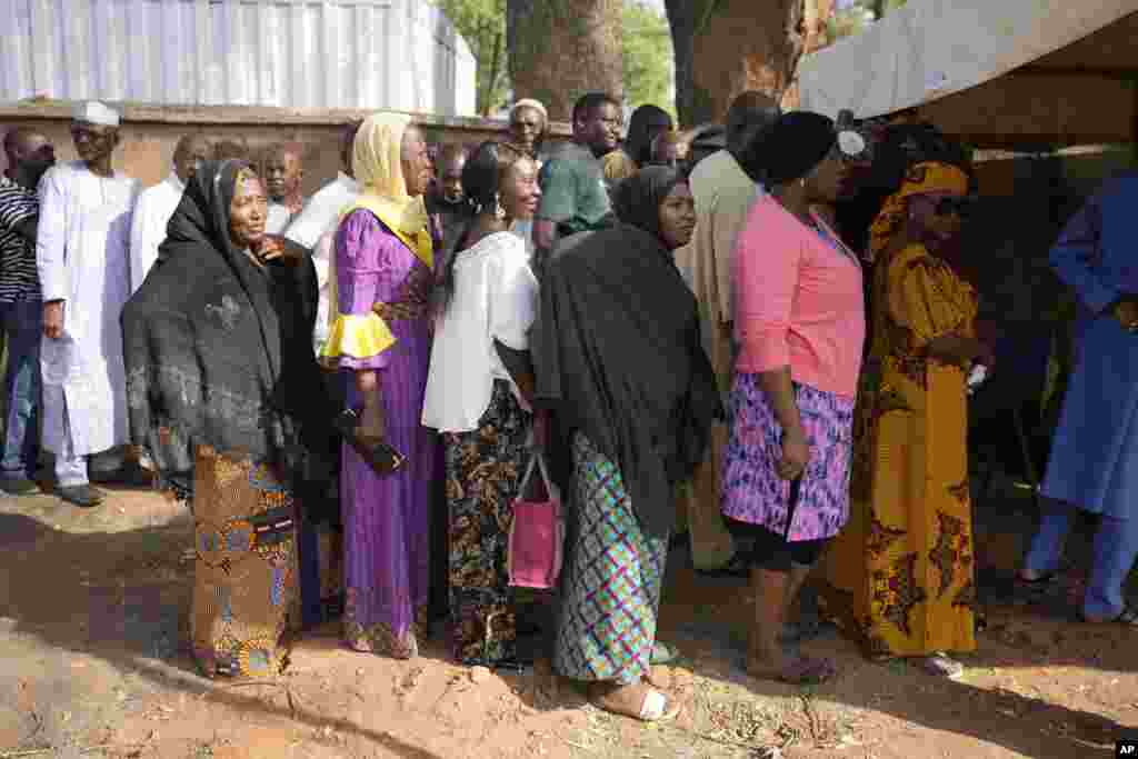 People queue to cast their votes during the presidential and parliamentary elections in Yola, Nigeria, Saturday, Feb. 25, 2023.