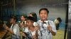 A dramatization of children in the "Hall of Orphans" begging for any information about parents, siblings and other relatives who went missing during the martial law years of the Philippines . EDSA Revolution Experiential Museum, Quezon City, Feb. 24, 2016. (S. Orendain/VOA)