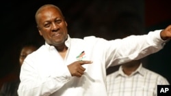 FILE: Ghana Incumbent President, John Dramani Mahama candidate of the National Democratic Congress gestures to his supporters during a presidential election rally at Accra Sports Stadium in Accra, Ghana, Dec. 5, 2016.