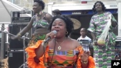 Liberian singer Tokay Tomah entertains the crowd with one of her hit songs "Chay-Chay Polay"