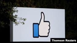FILE - The entrance sign to Facebook headquarters in Menlo Park, Calif., Oct. 10, 2018. 