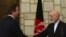 Afghan President Hamid Karzai, right, shakes hands with British Prime Minister David Cameron during a press conference at the presidential palace in Kabul, Afghanistan, June 29, 2013.